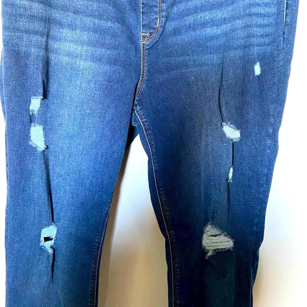 One Pair of distressed jeans. Maker is Hue XL